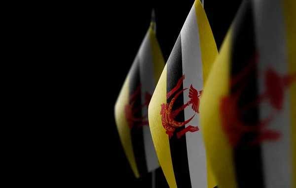 Small national flags of the Brunei on a black background — Stock Photo, Image