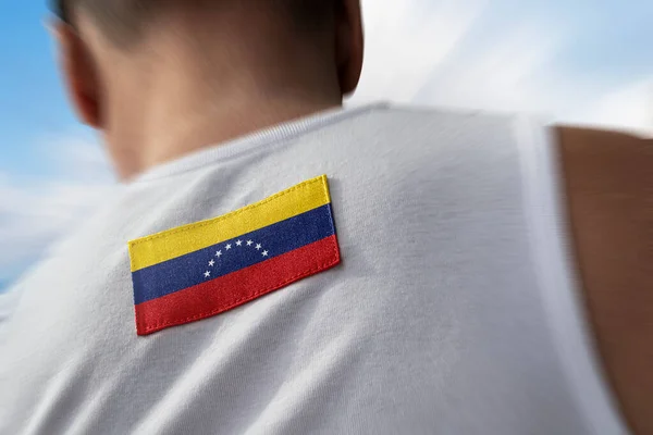 La bandera nacional de Venezuela sobre los atletas — Foto de Stock