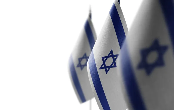 Malé národní vlajky Izraele na bílém pozadí — Stock fotografie