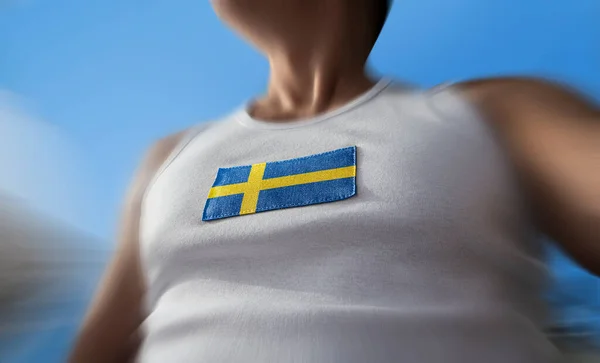 Nationell flagga av Sverige på idrottare bröstet — Stockfoto