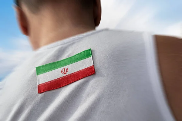 La bandera nacional de Irán sobre los atletas espalda —  Fotos de Stock