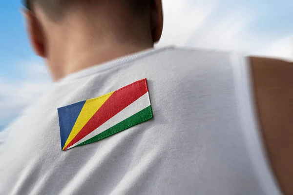 La bandiera nazionale delle Seychelles sugli atleti torna — Foto Stock