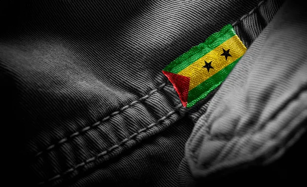 Tag on dark clothing in the form of the flag of the Sao Tome and Principe — Stock Photo, Image