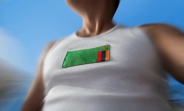 The national flag of Zambia on the athletes chest — Stock Photo, Image