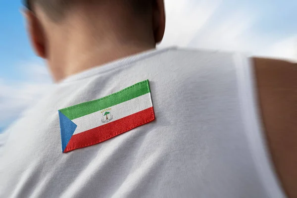 Bandeira nacional da Guiné Equatorial nas costas dos atletas — Fotografia de Stock