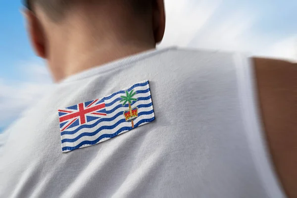 La bandera nacional del Territorio Británico del Océano Índico sobre los atletas — Foto de Stock