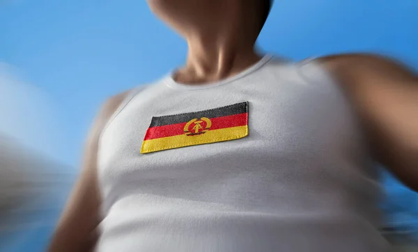 Bandeira nacional da RDA no peito dos atletas — Fotografia de Stock