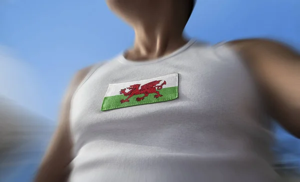 Nationell flagga Wales på idrottare bröstet — Stockfoto