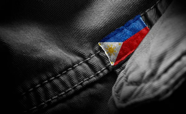 Tag on dark clothing in the form of the flag of the Philippines — Stock Photo, Image