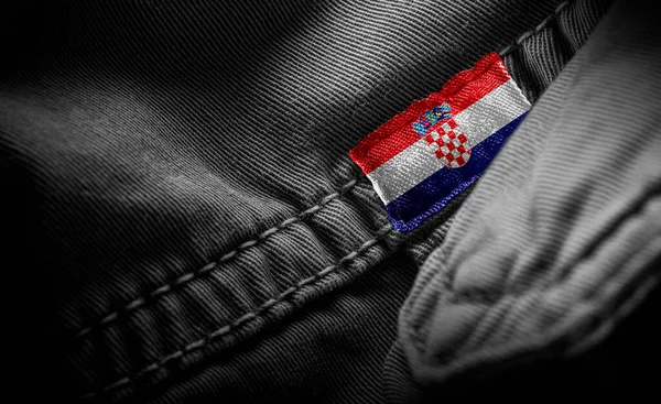 Tag on dark clothing in the form of the flag of the Croatia — Stock Photo, Image