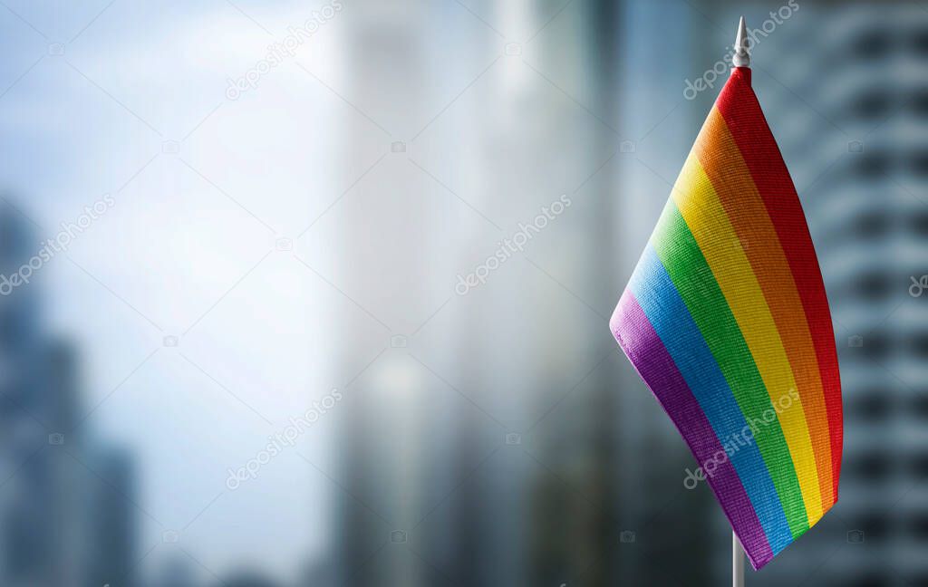 Small national flags of the lgbt on a light blurry background