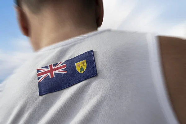 La bandera nacional de Islas Turcas y Caicos en la espalda de los atletas —  Fotos de Stock