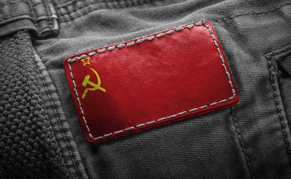 Tag na roupa escura na forma da bandeira da URSS — Fotografia de Stock