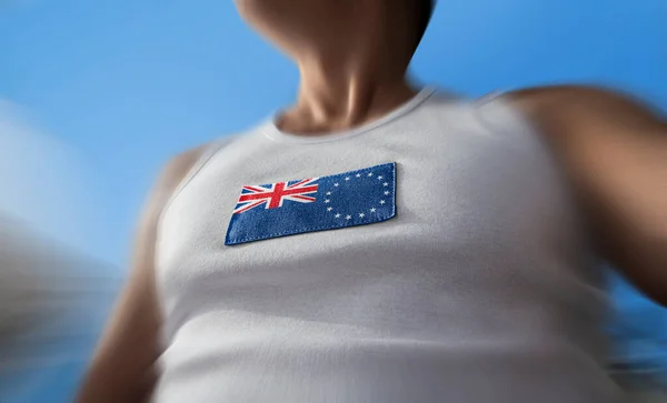 The national flag of Cook Islands on the athletes chest — Stock Photo, Image