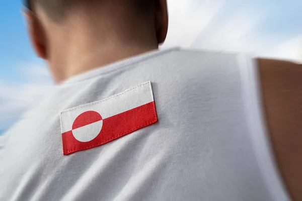 Государственный флаг Гренландии на спине спортсменов — стоковое фото