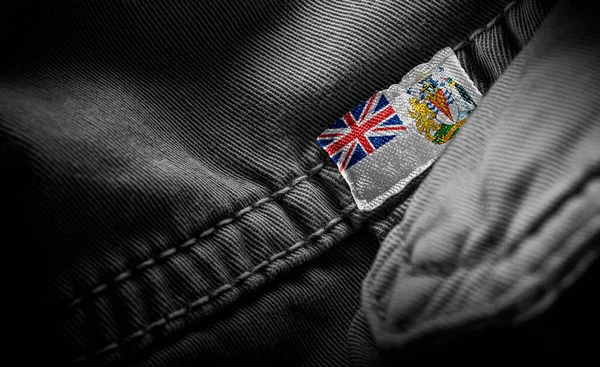 Znacznik na ciemnej odzieży w formie flagi Brytyjskiego Terytorium Antarktycznego — Zdjęcie stockowe