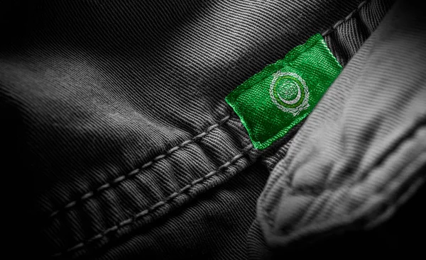 Tag on dark clothing in the form of the flag of the Arab League — Stock Photo, Image