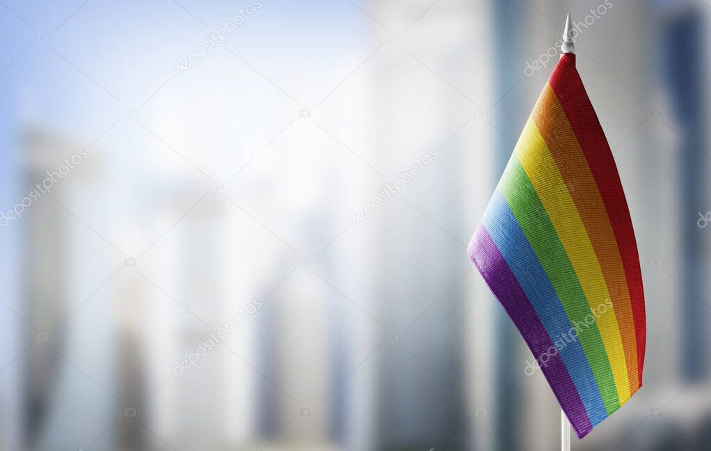 Small national flags of the lgbt on a light blurry background