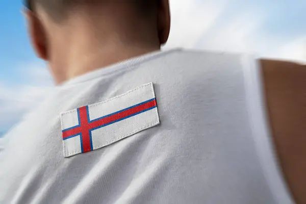 The national flag of Faroe Islands on the athletes back — Stock Photo, Image