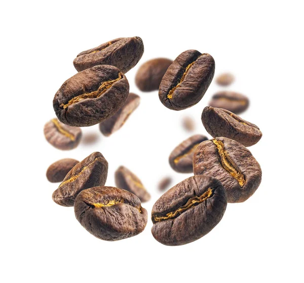Les grains de café lévitent sur un fond blanc — Photo