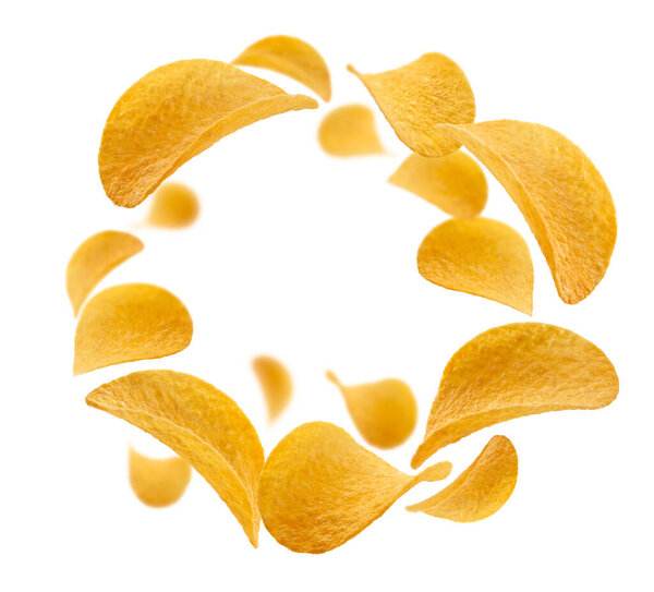 Potato chips levitate on a white background