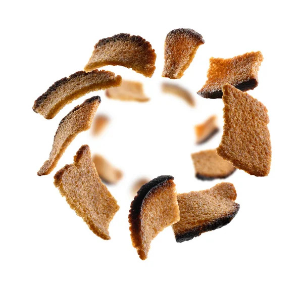 Rye croutons levitate on a white background — Stock Photo, Image