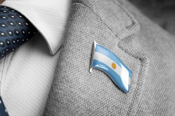 Metal badge with the flag of Argentina on a suit lapel — Stock Photo, Image
