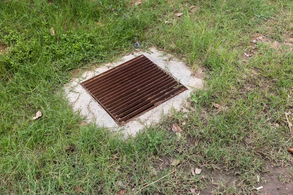 Close Grille Drain Sewer Grass Field Water Recirculation System Wastewater — Stock Photo, Image