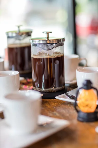 French Press Coffee Maker. Morning concept. coffee siphon. Spent coffee break at the organic cafe and prepare Chocolate or tea in French press.