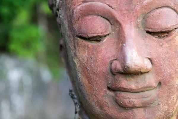 Bir mutlu gülümseme Buda'nın çehresini yakın çekim — Stok fotoğraf