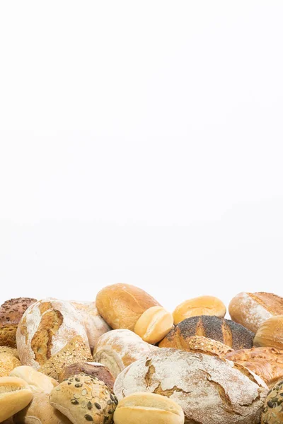 Many kinds and kinds of bread collected in one place as decoration for a traditional bakery. White background from the top for self-completion. — Stock Photo, Image