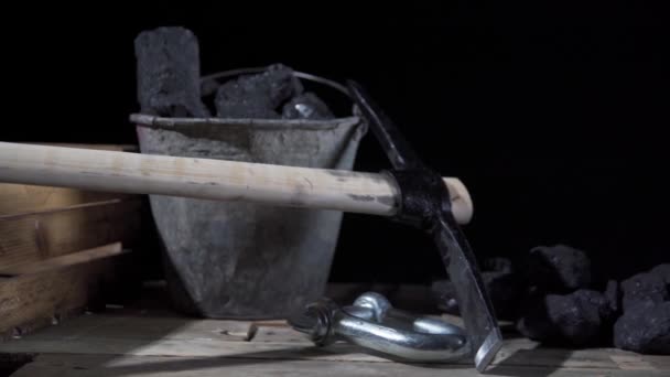 Panorama from coal bucket to mining pickaxe to dust mask with filter — Stock Video