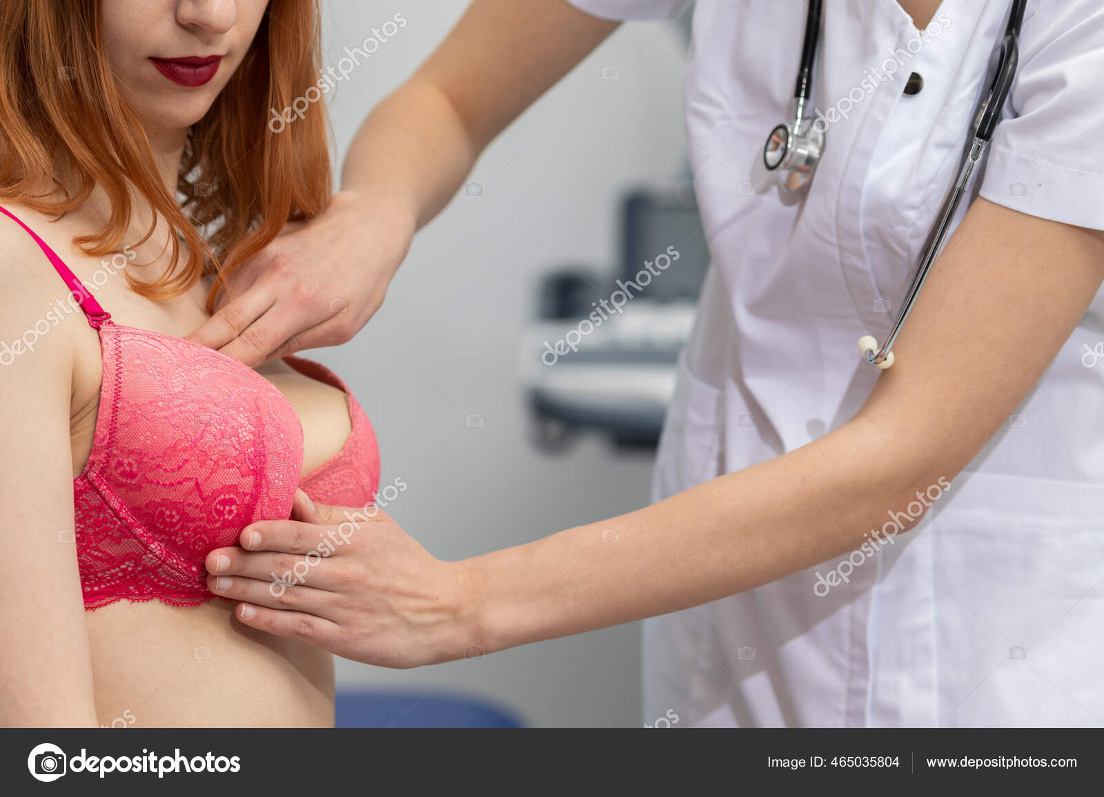 The doctor examines the patients breasts with her hands to rule out the possibility of lumps appearing and resulting in breast cancer Stock Photo by ©info.fotodrobik.pl 465035804
