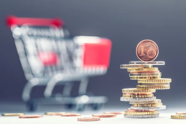 Euro coins. Euro money. Euro currency.Coins stacked on each other in different positions. Money concept. Shopping trolley. Shopping cart