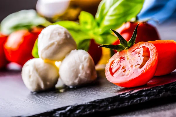 Tomatoes. Cherry tomatoes. Cocktail tomatoes. Fresh grape tomatoes carafe with olive oil on table. Toned photo — Stockfoto