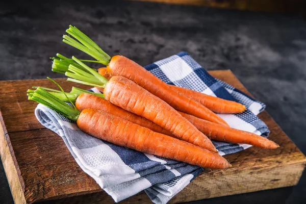 Carrot. Fresh Carrots bunch. Baby carrots. Raw fresh organic orange carrots. Healthy vegan vegetable food