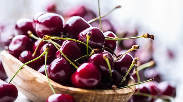 Cherries. Sweet Cherries. Fresh Cherries. Ripe cherries on wooden concrete table - board