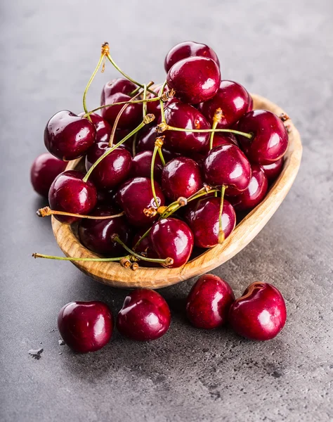 Cherries. Sweet Cherries. Fresh Cherries. Ripe cherries on wooden concrete table - board