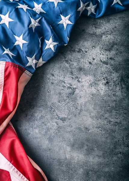 USA flag. American flag. American flag freely lying on concrete background. Close-up Studio shot. Toned Photo — Stock Photo, Image