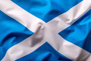 Scotland flag. Scottish flag of fabric blowing in the wind clipart