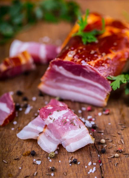 Bacon. Smoked bacon parsley herb salt pepper and garlic.Stll life studio shot — Stock Photo, Image