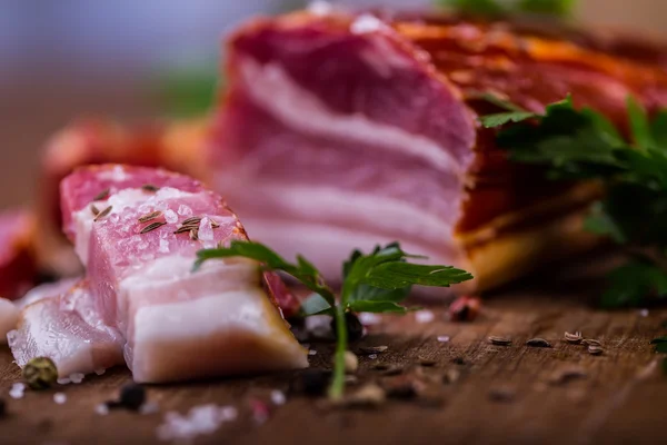 Bacon. Smoked bacon parsley herb salt pepper and garlic.Stll life studio shot — Stock Photo, Image