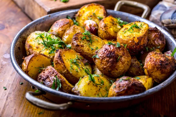 Potato. Roasted potatoes. American potatoes with smoked bacon garlic salt pepper cumin dill parsley - herb decoration