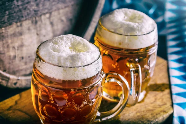 Beer. Oktoberfest.Two cold beers. Draft beer. Draft ale. Golden beer. Golden ale. Two gold beer with froth on top. Draft cold beer in glass jars in pub hotel or restaurant. Still life — Stock Photo, Image