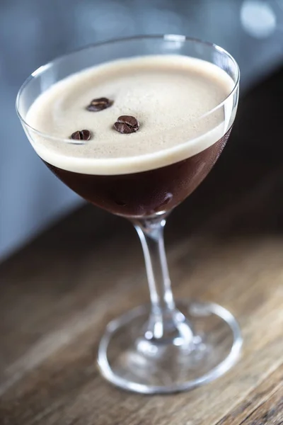 Espresso martini vodka short drink as a coffee cocktail inclduing coffee liqueur and vanilla syrup.