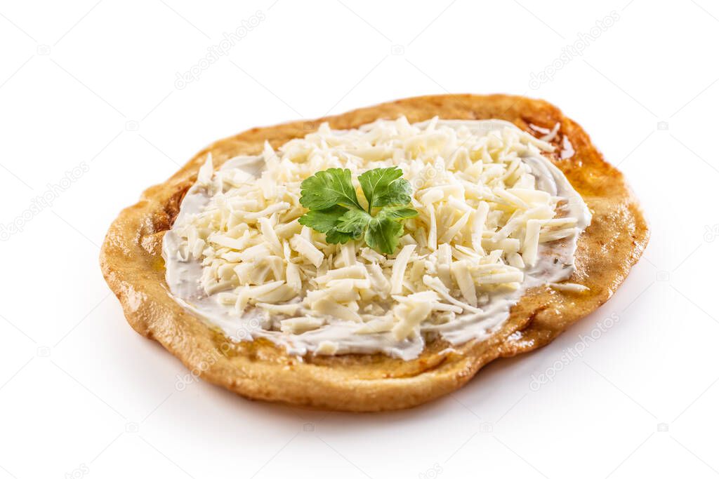 Traditional huangarian creamy langos with cheese, garlic and herbs