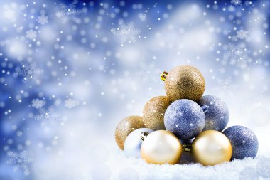 Christmas balls and snowy background Christmas card. clipart