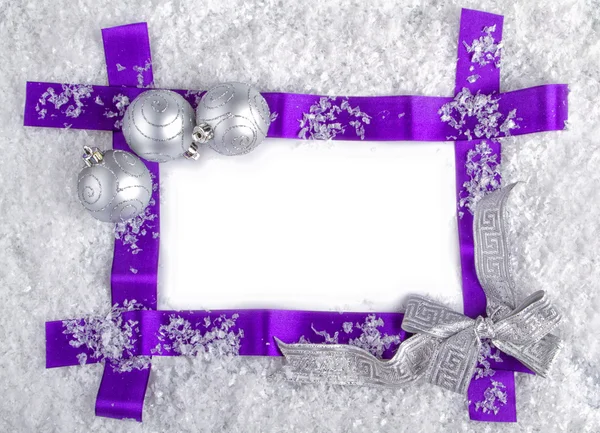 Christmas purple ribbon frame with silver balls and snow. — Stock Photo, Image