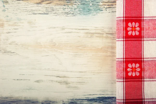 Top view of checkered napkin on old wooden table — Stock Photo, Image
