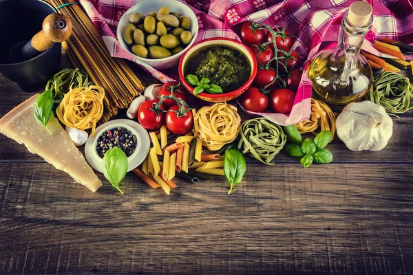 Italian and Mediterranean food ingredients on old wooden background. — Stock Photo, Image